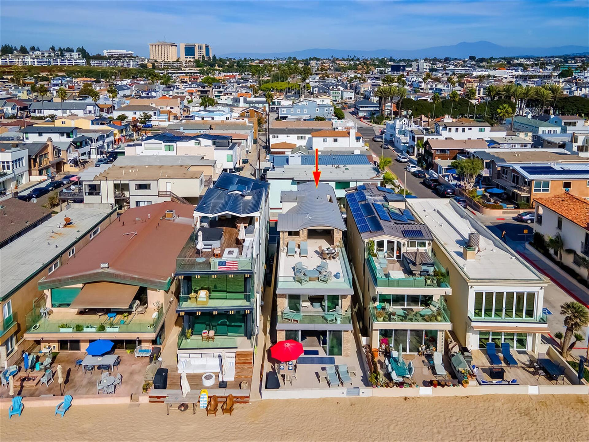 Beachfront houses with solar panels.