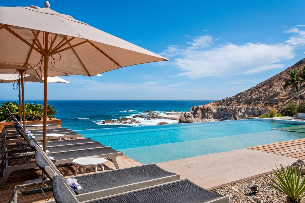 Poolside loungers with ocean view.