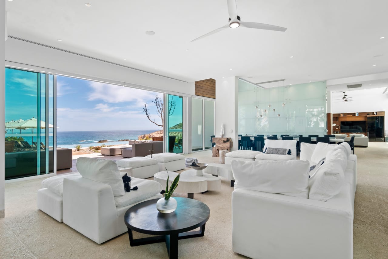 Modern ocean-view living room interior.