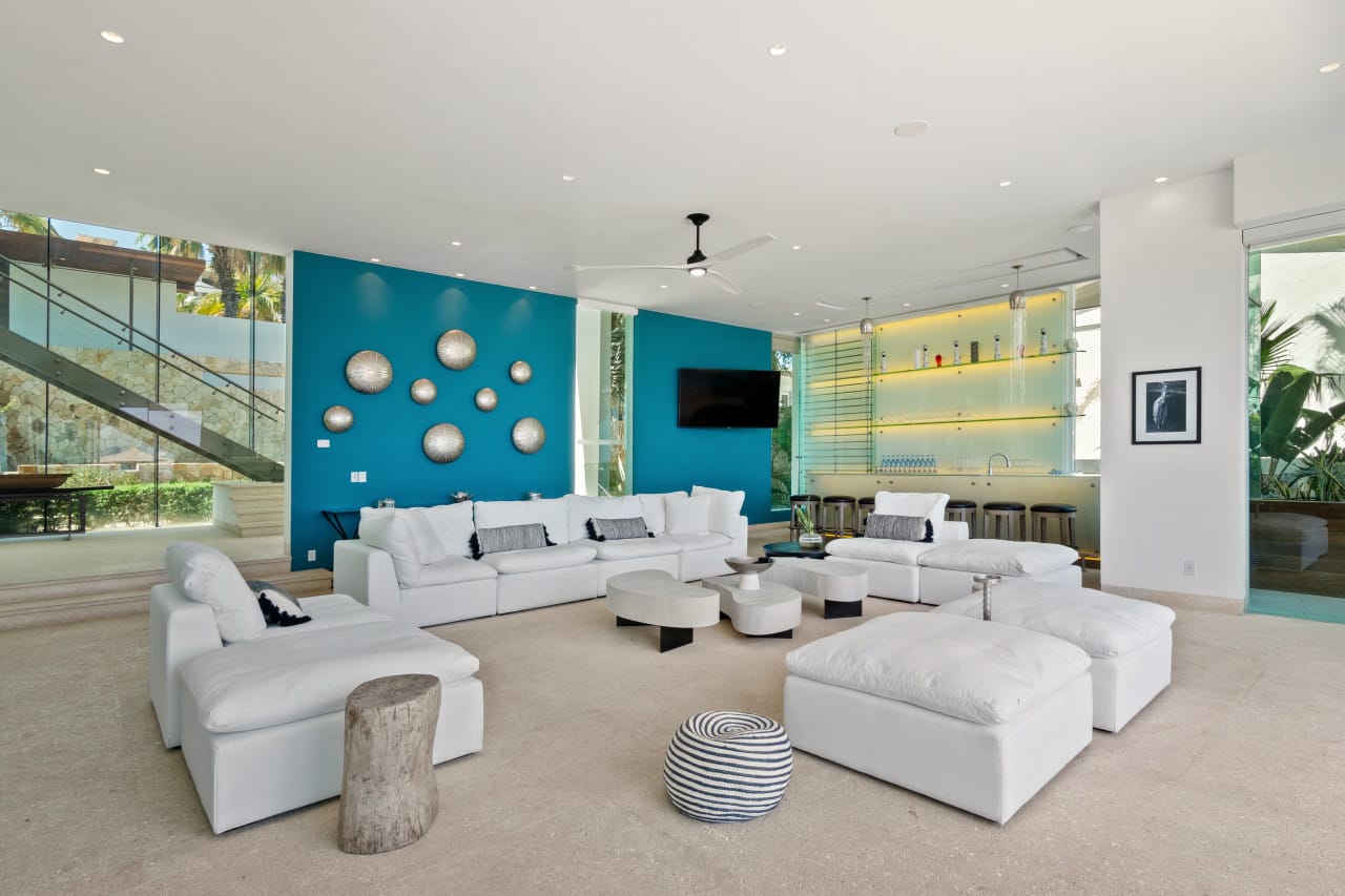 Modern living room with blue accent.