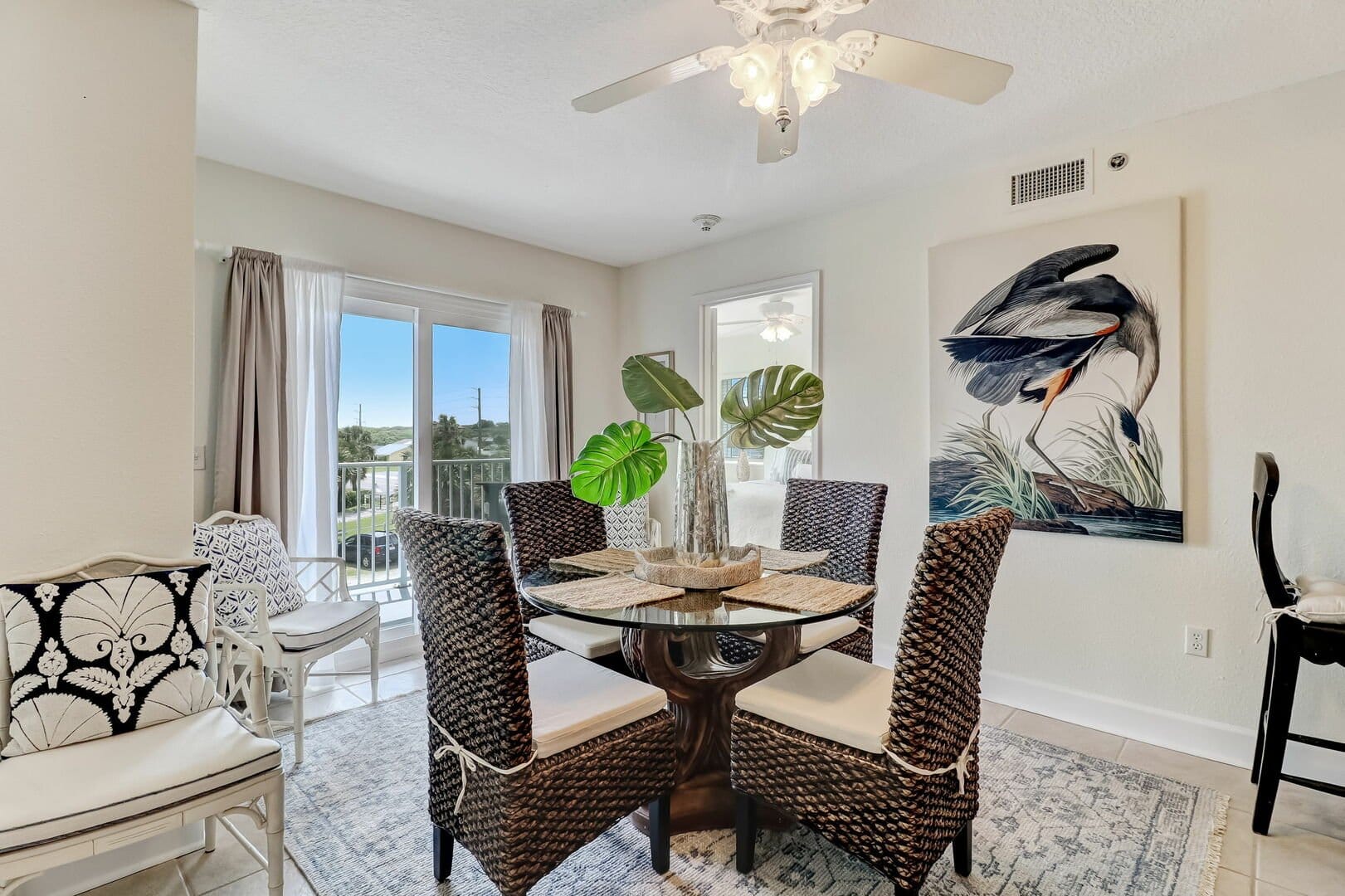 Dining room with artwork and plants.