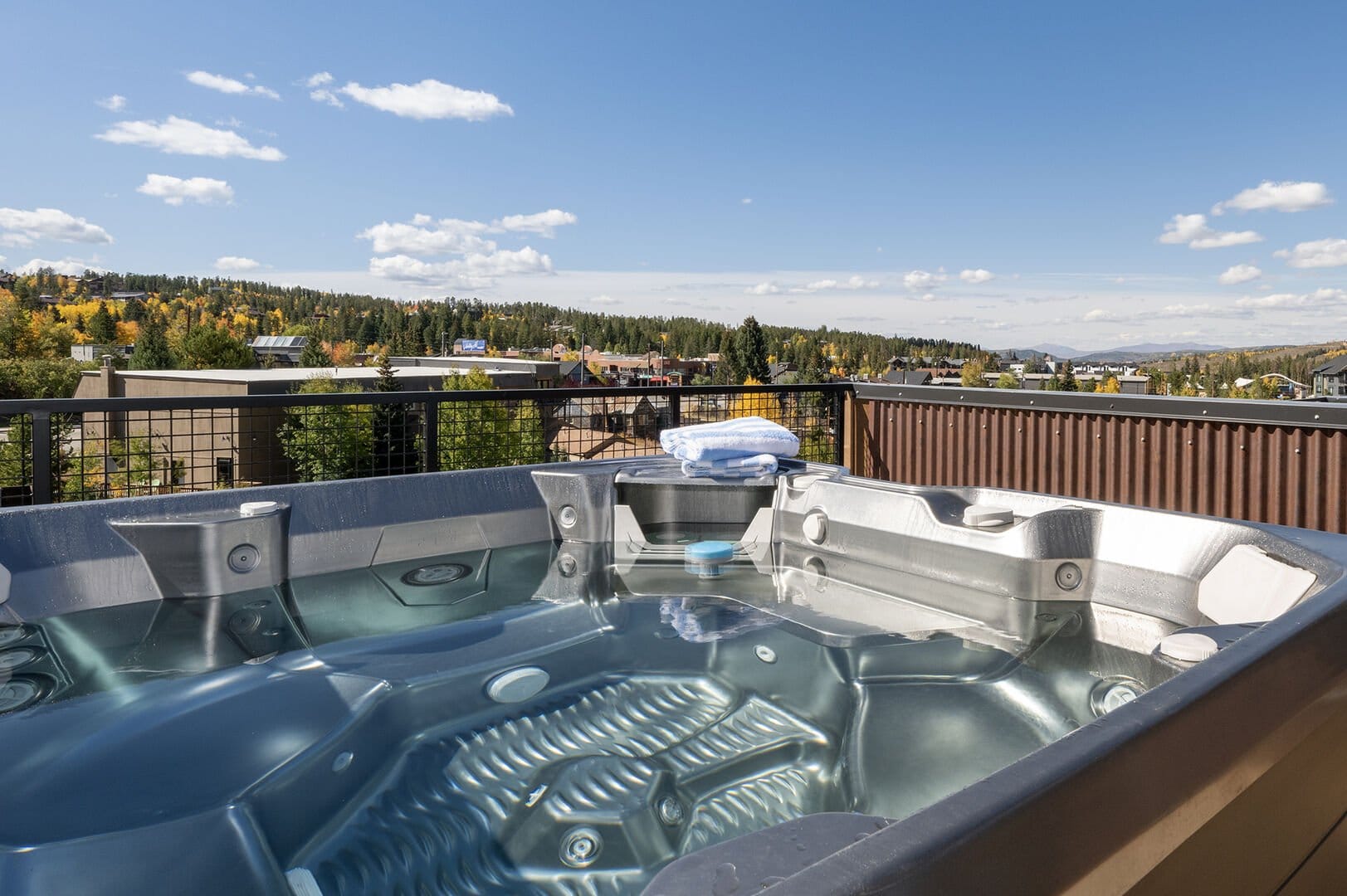 Rooftop hot tub with scenic view.