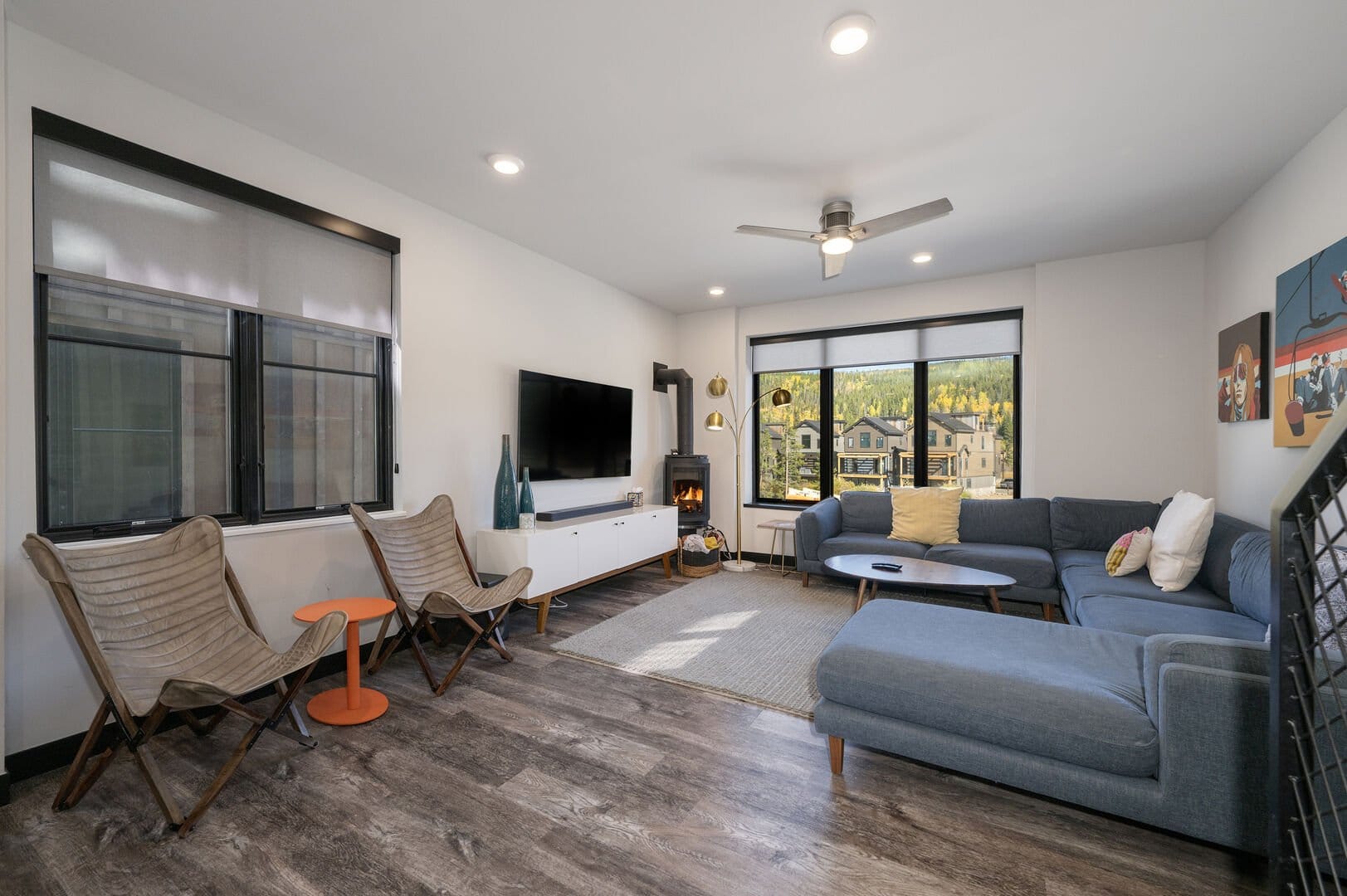 Modern living room with large windows.