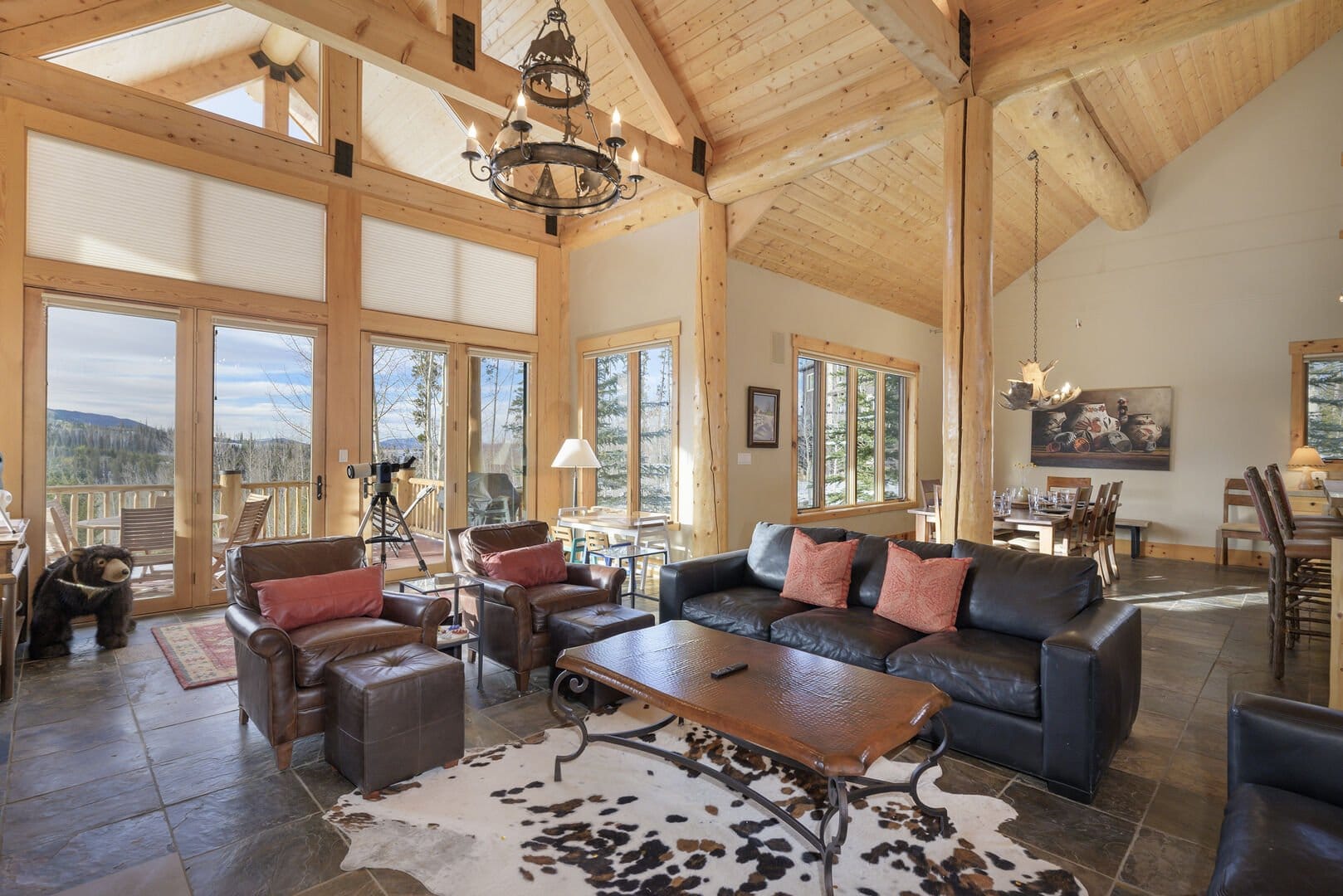 Rustic living room with large windows.