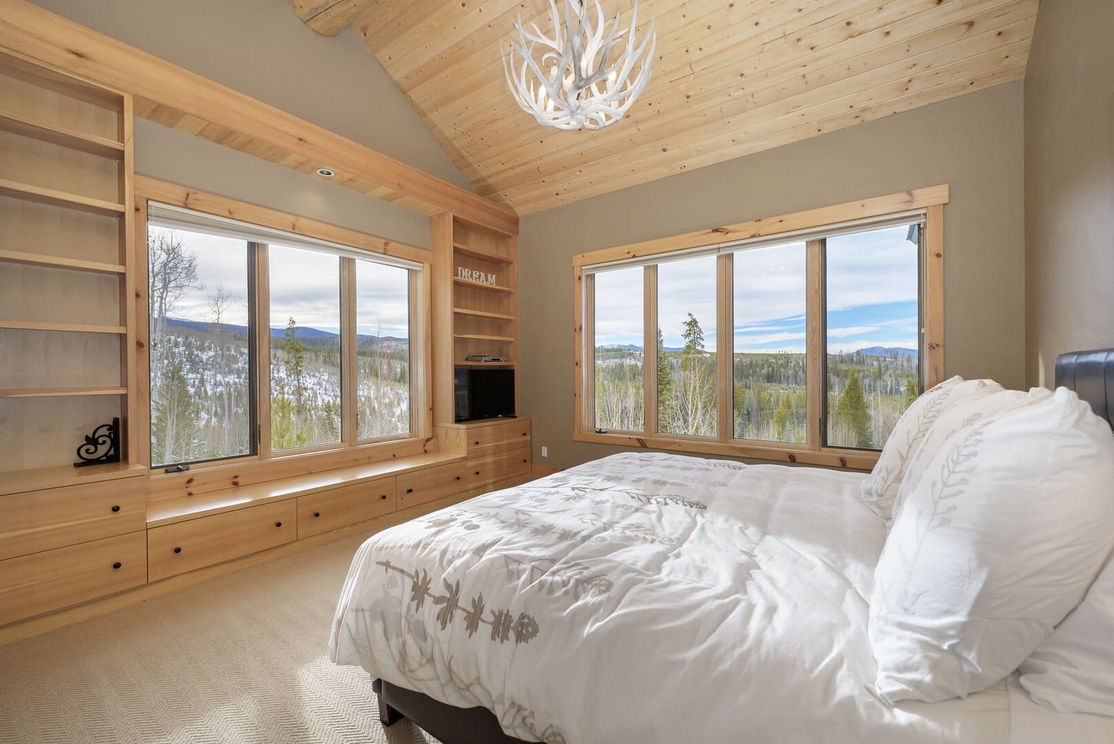 Cozy bedroom with forest view.