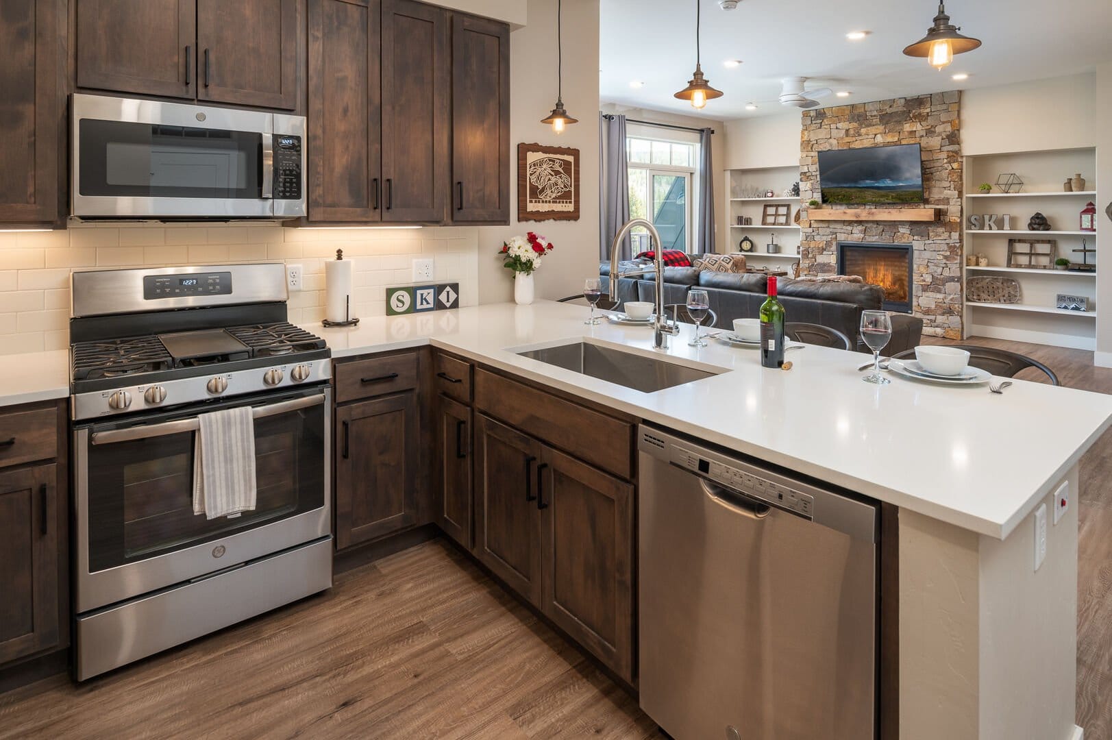 Modern kitchen with island and fireplace.