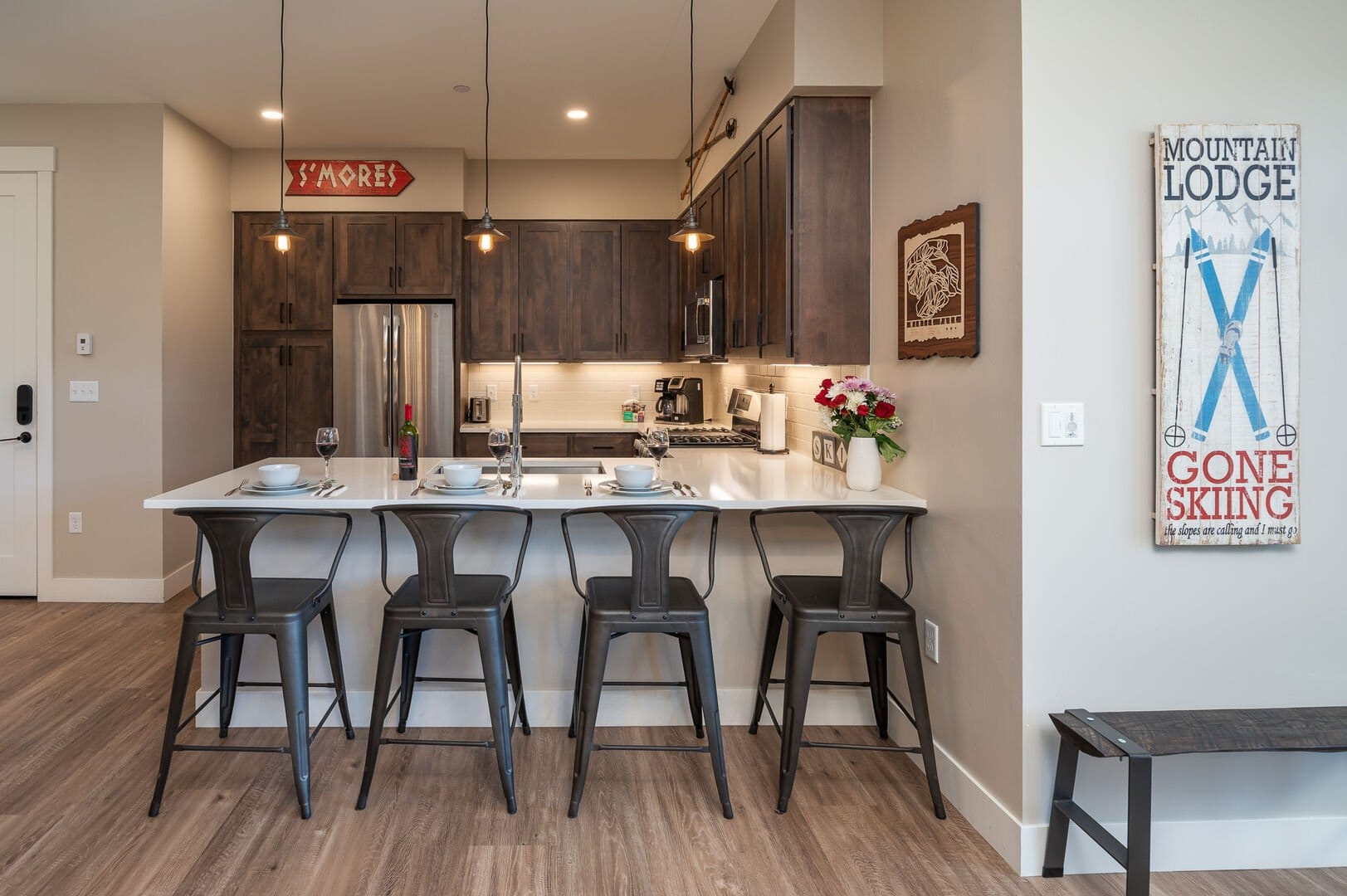 Cozy kitchen with barstools and decor.