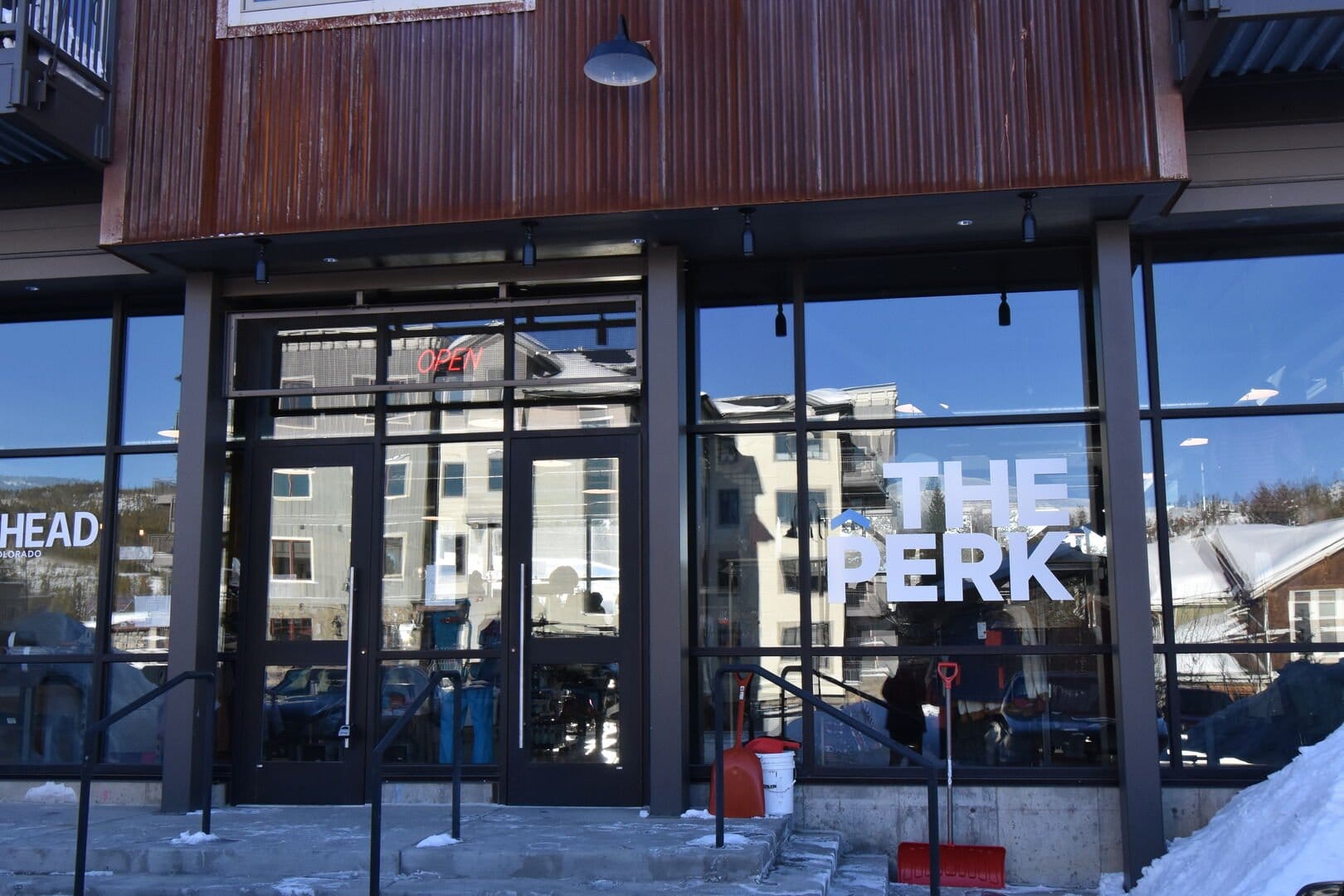 Cafe exterior with snow shovels.