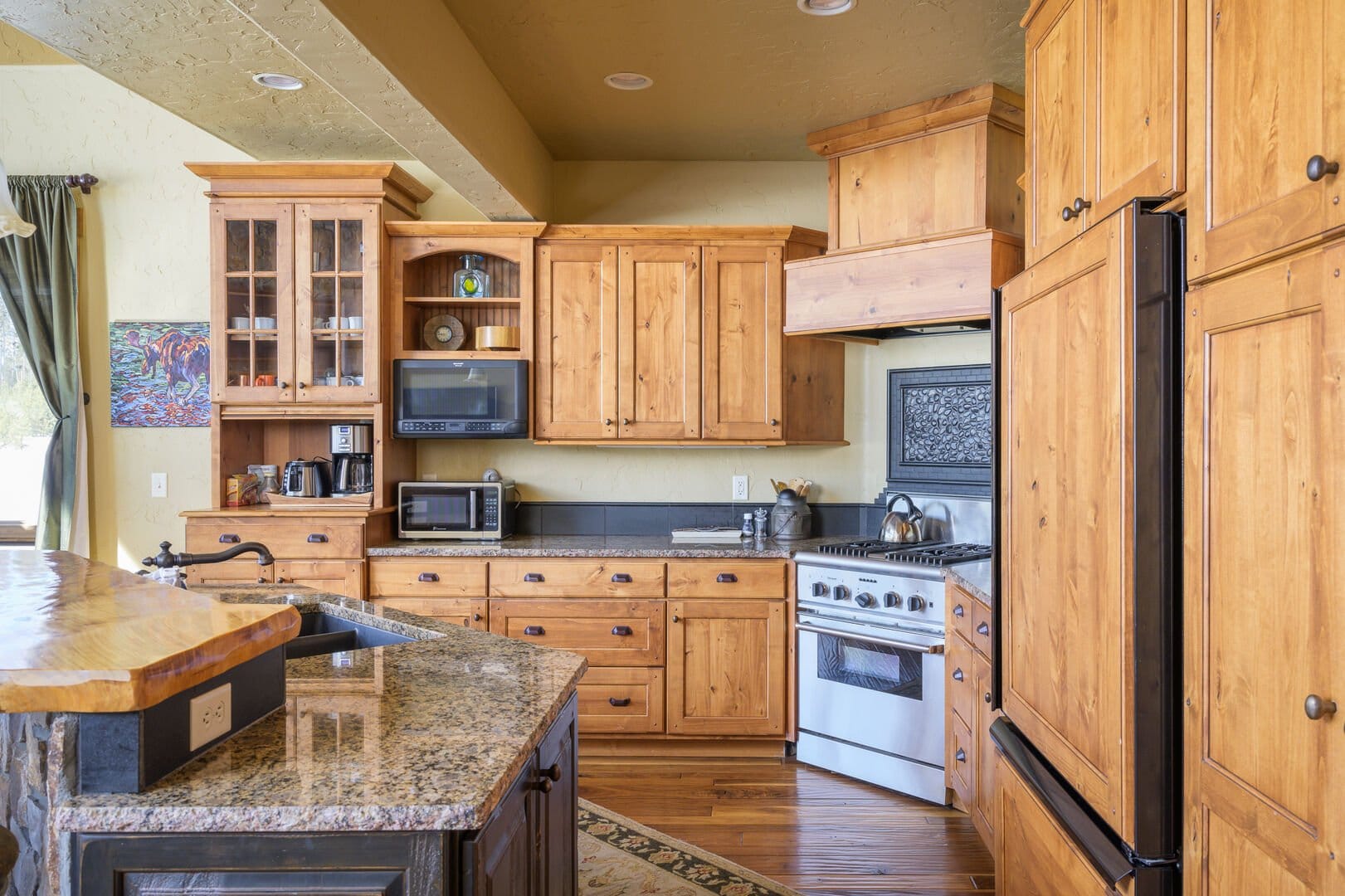 Rustic kitchen with wooden cabinets.