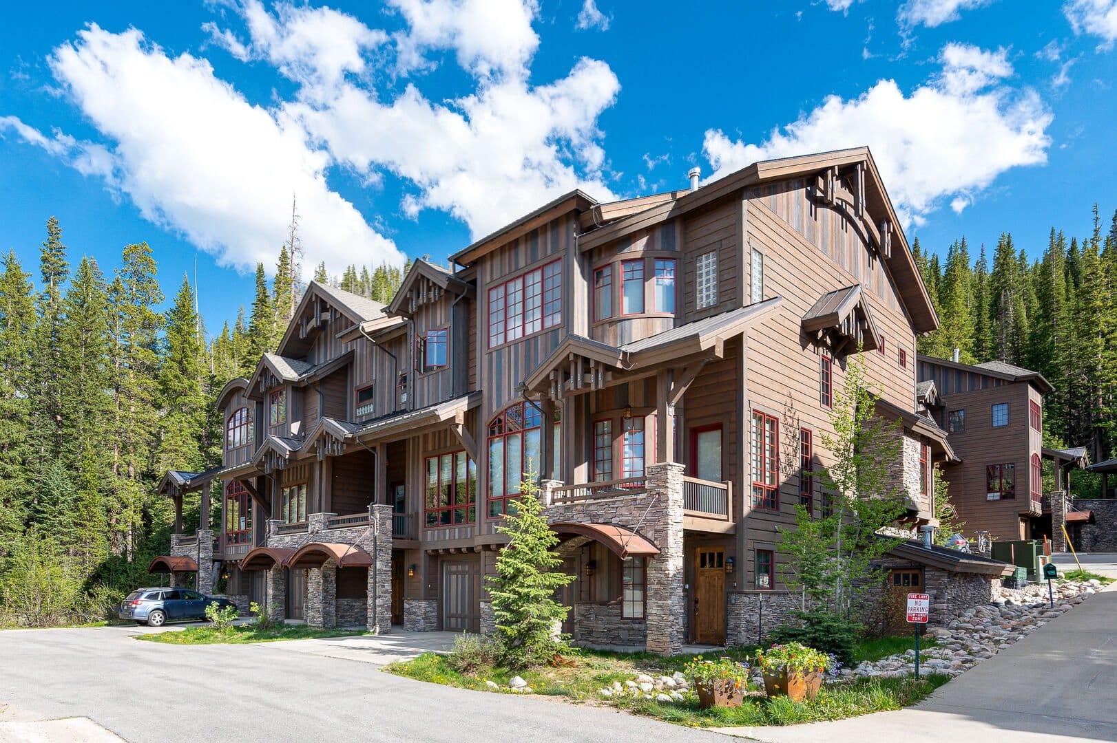 Large wooden mountain lodge building.