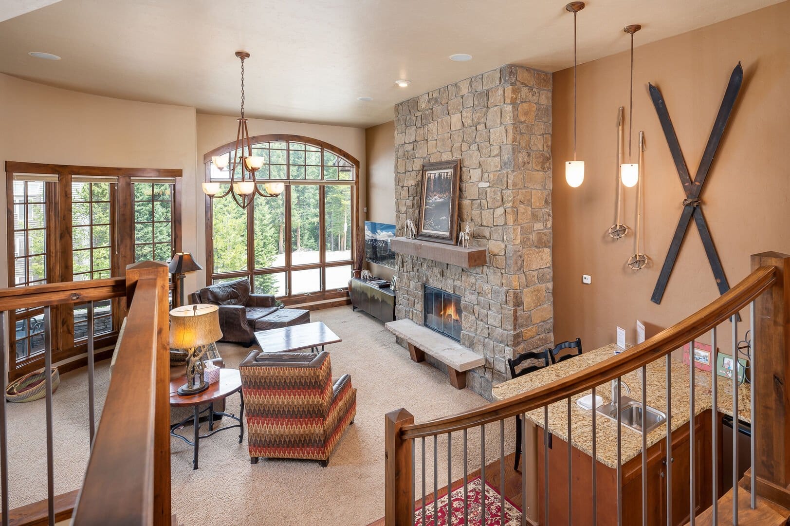 Rustic living room with stone fireplace.