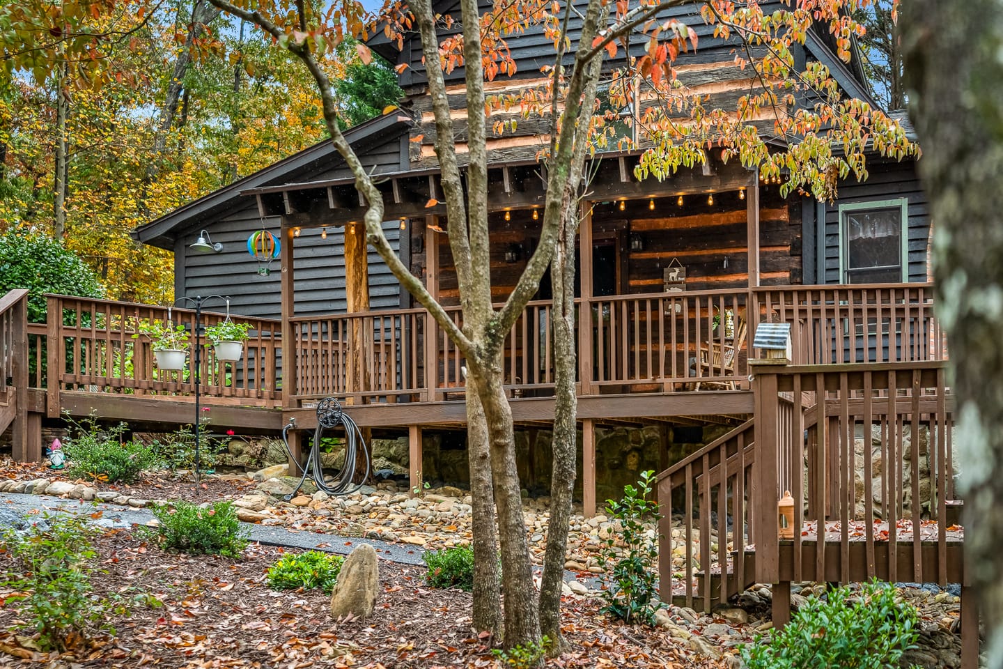 Rustic cabin with autumn foliage.