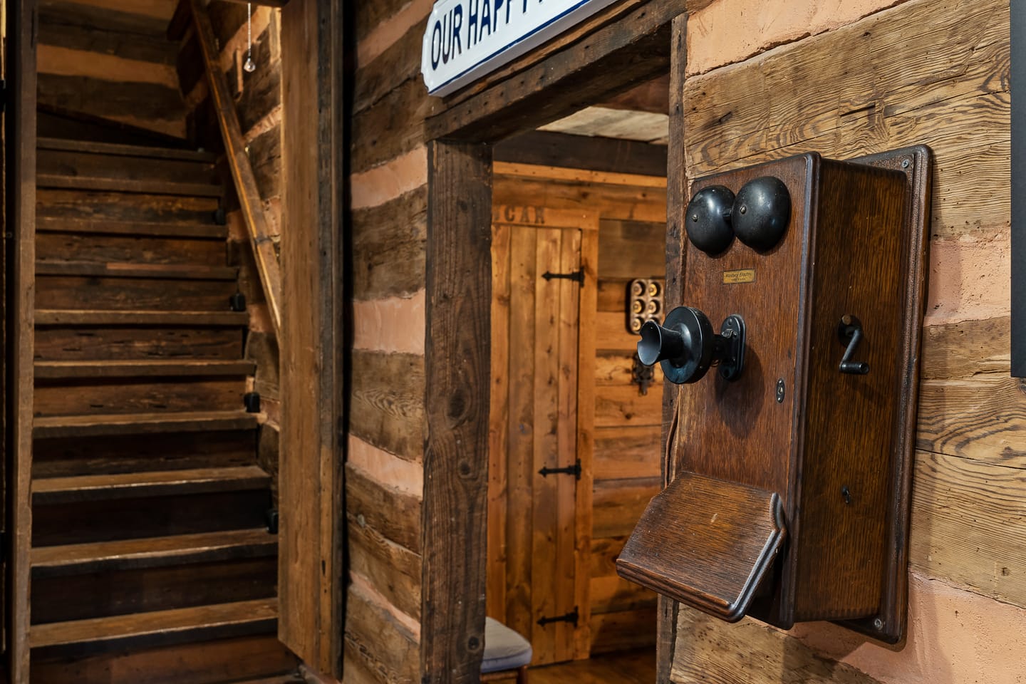 Vintage telephone on rustic wall.