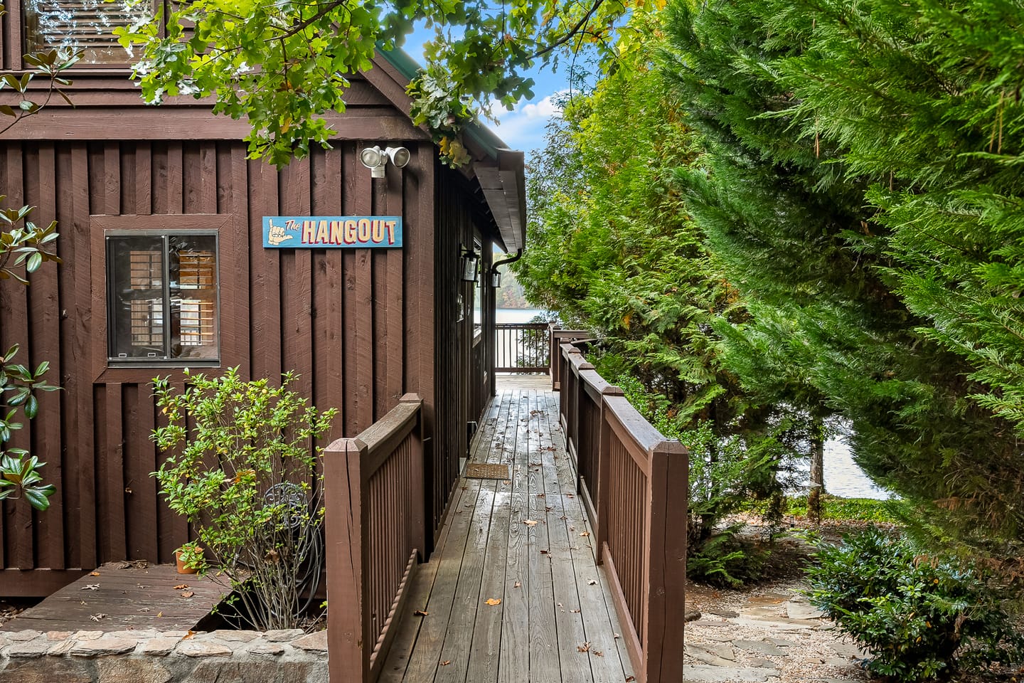 Wooden cabin with "The Hangout" sign.