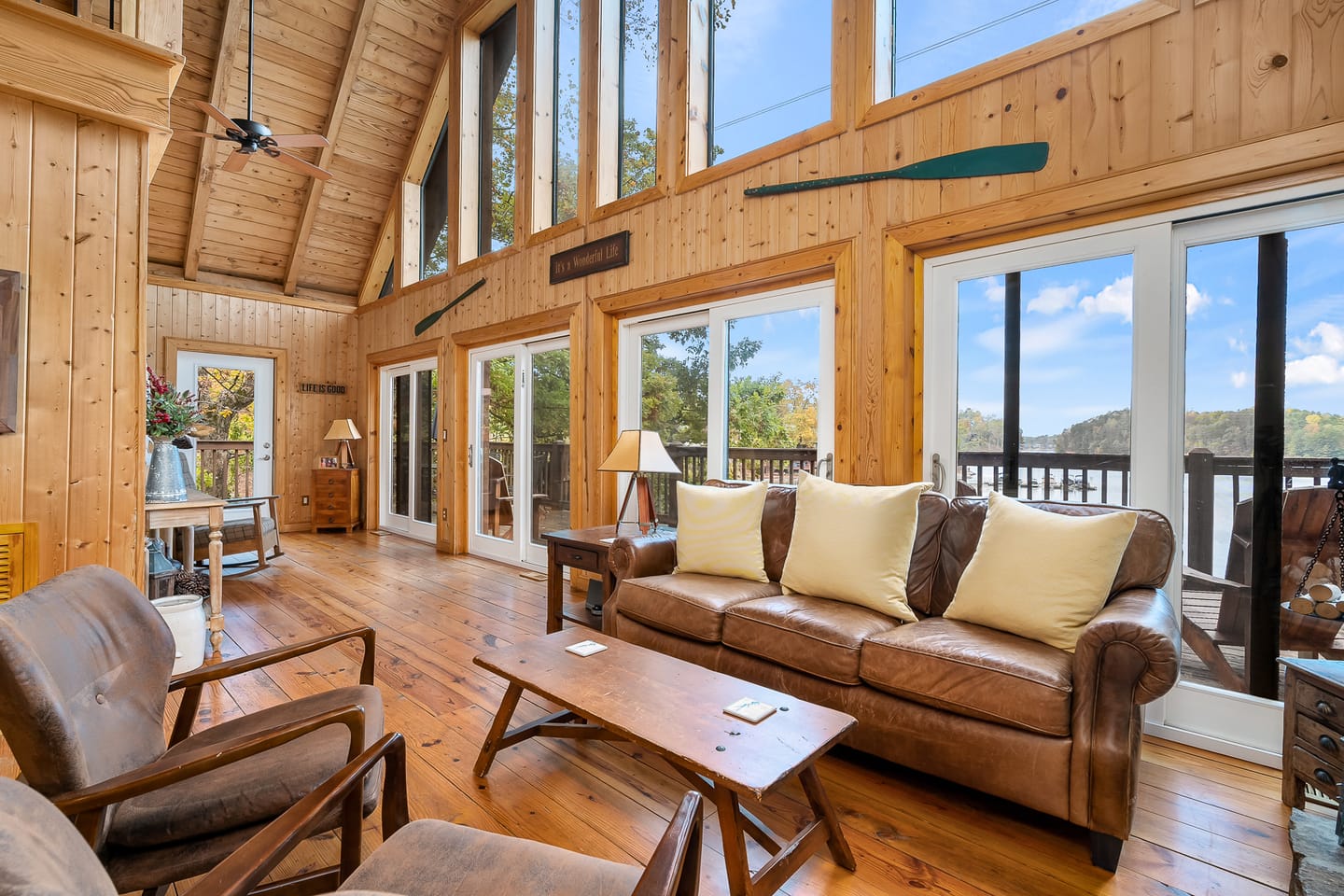 Rustic living room with large windows.