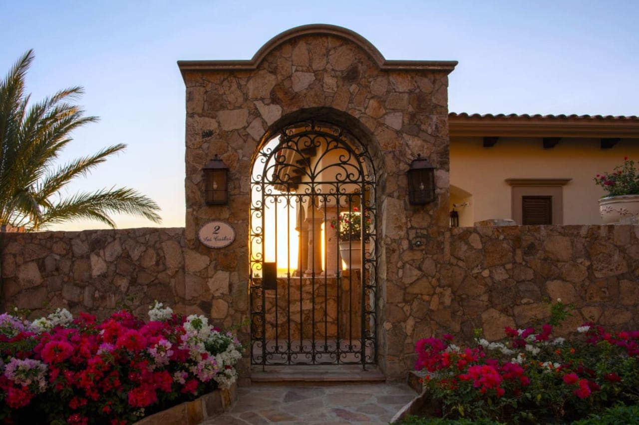 Stone archway with iron gate.