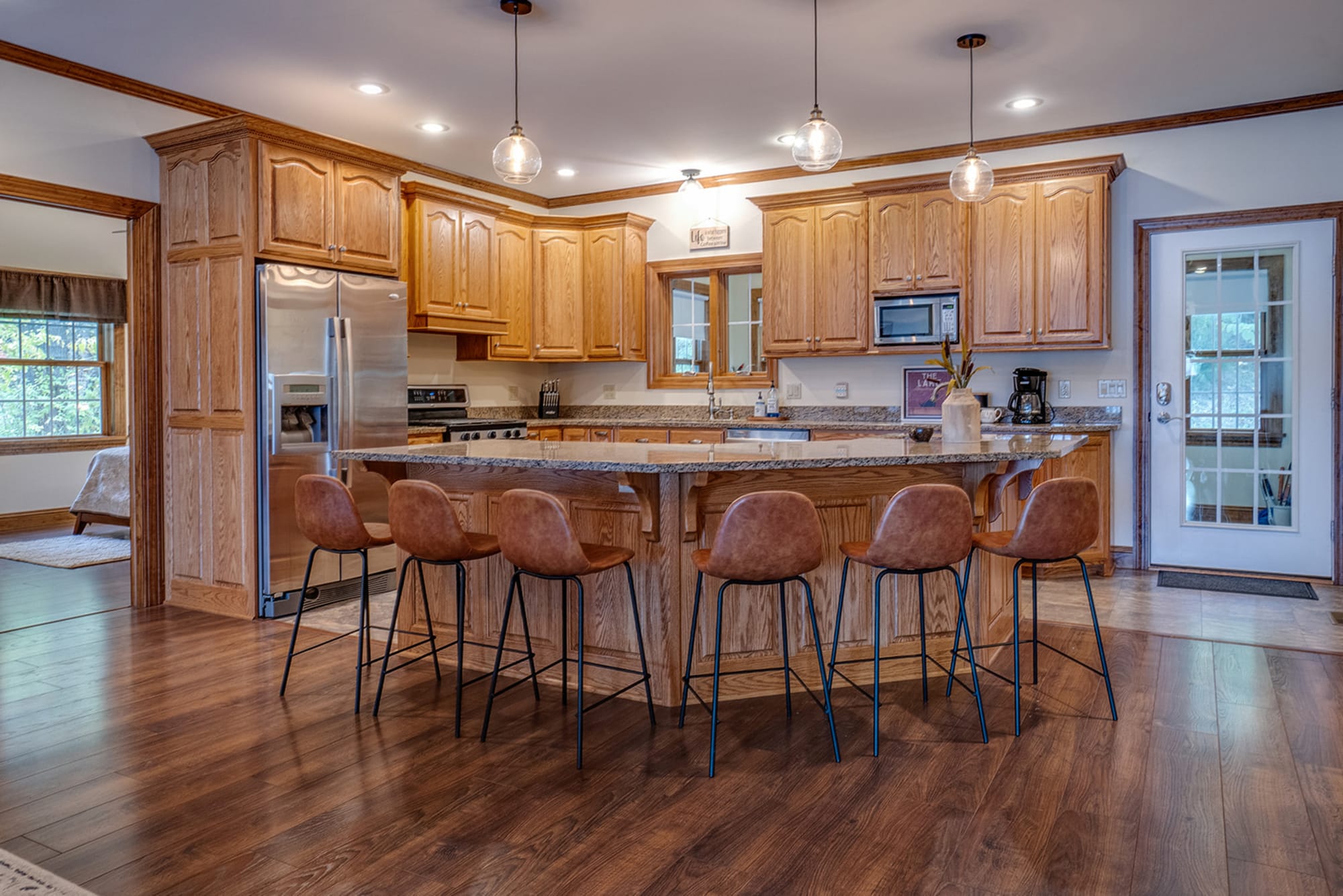 Spacious kitchen with wooden cabinets.