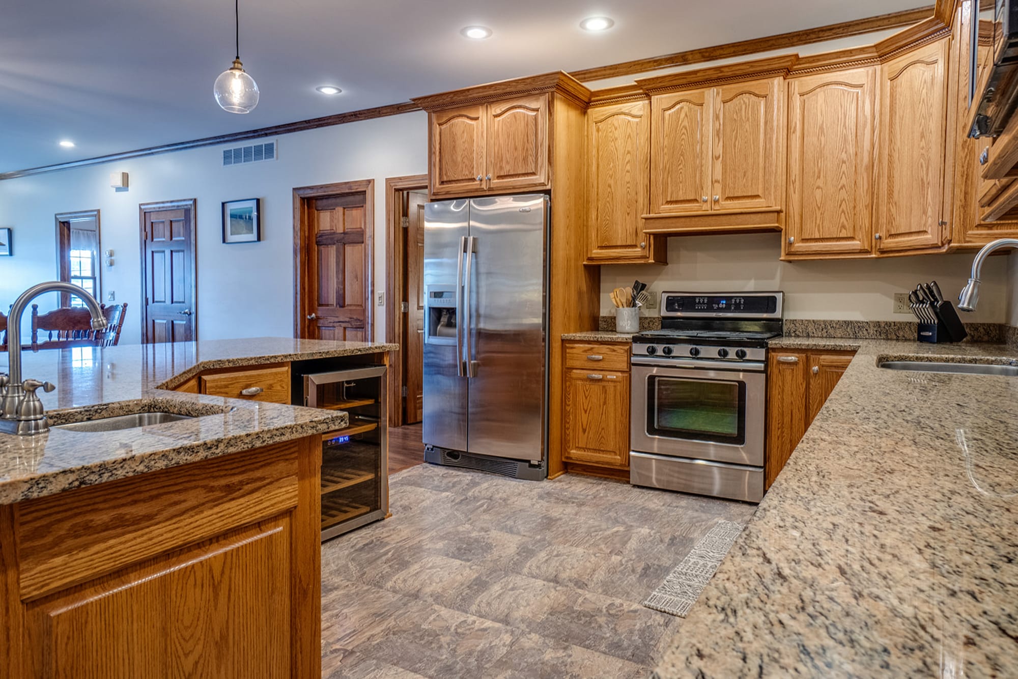 Spacious kitchen with wooden cabinets.