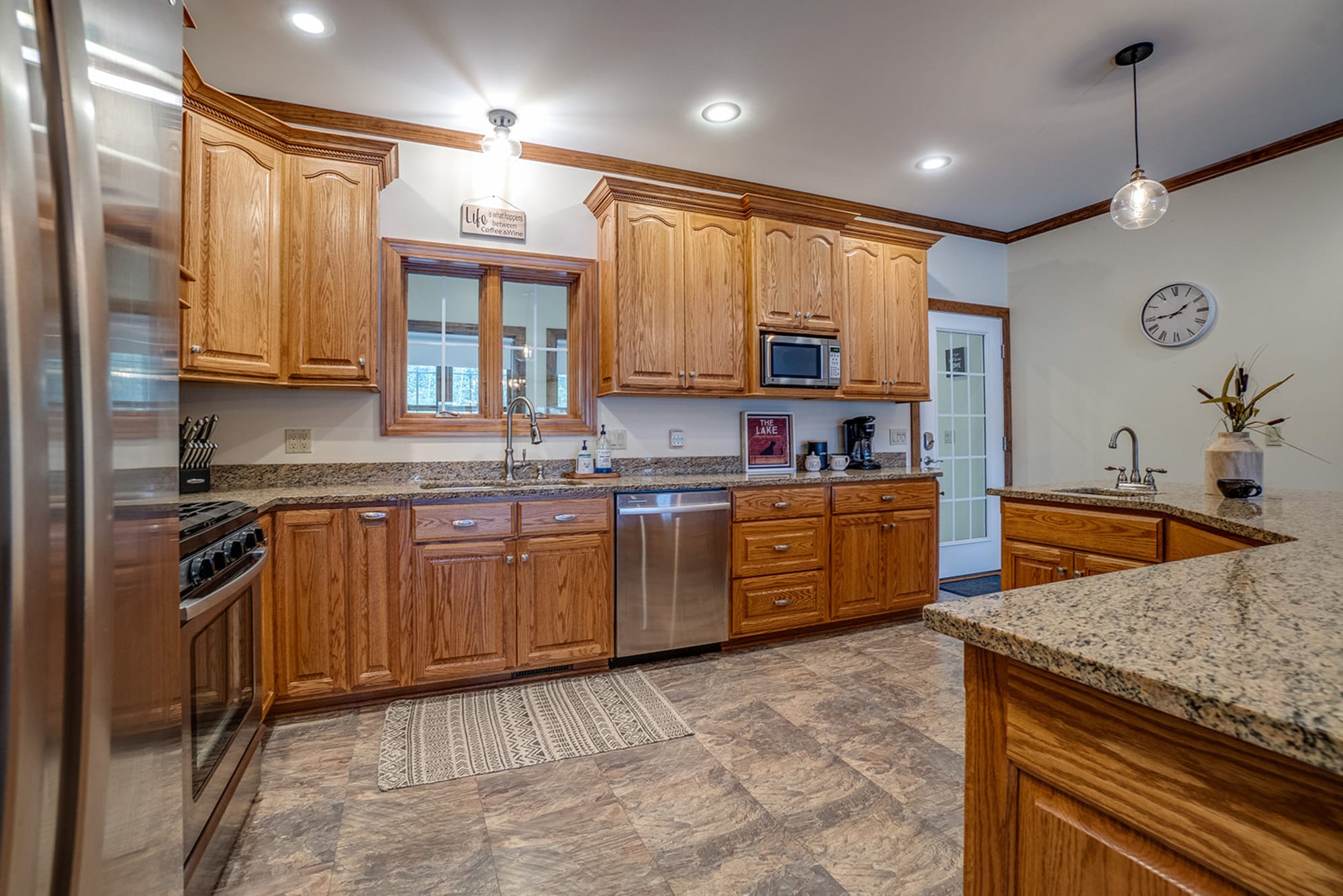 Traditional wooden kitchen with appliances.