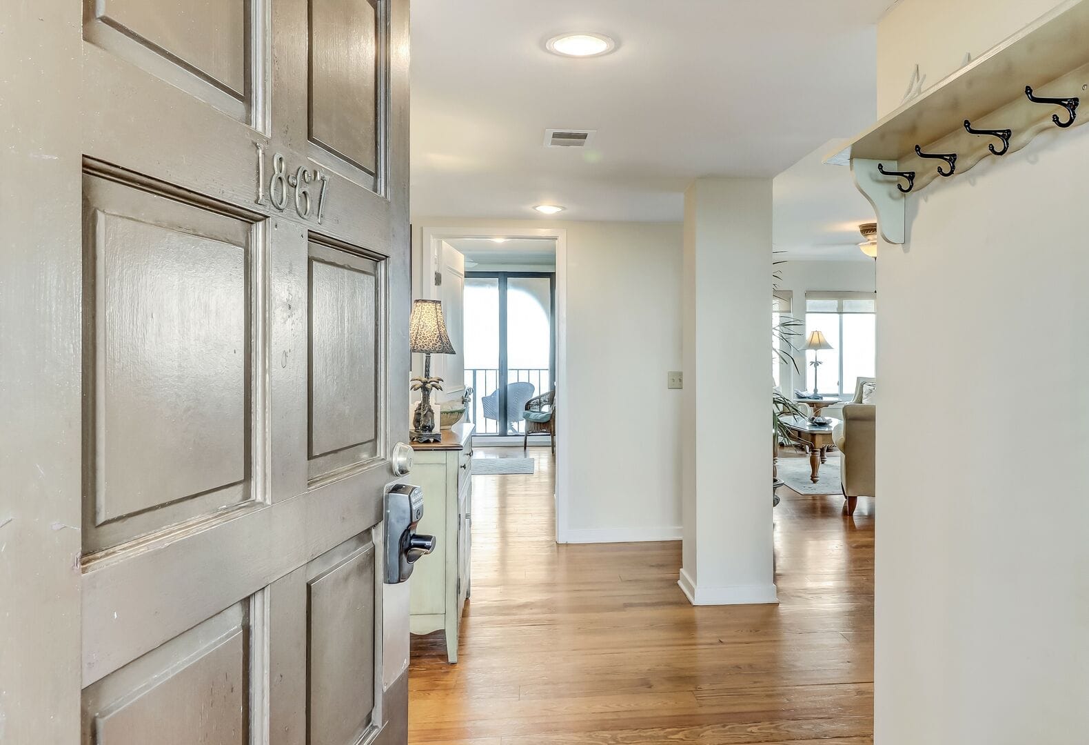 Open door to bright living room.