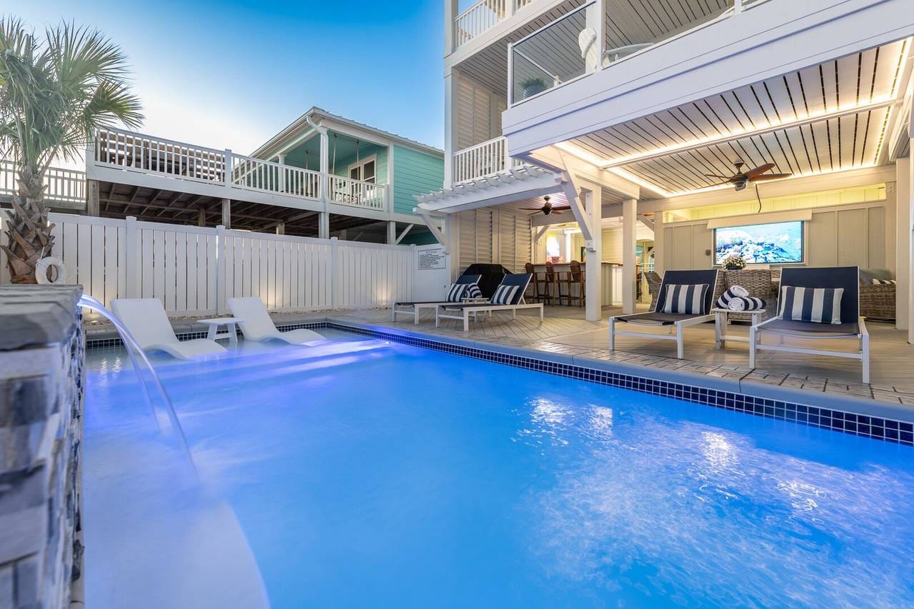 Outdoor pool with lounge chairs.