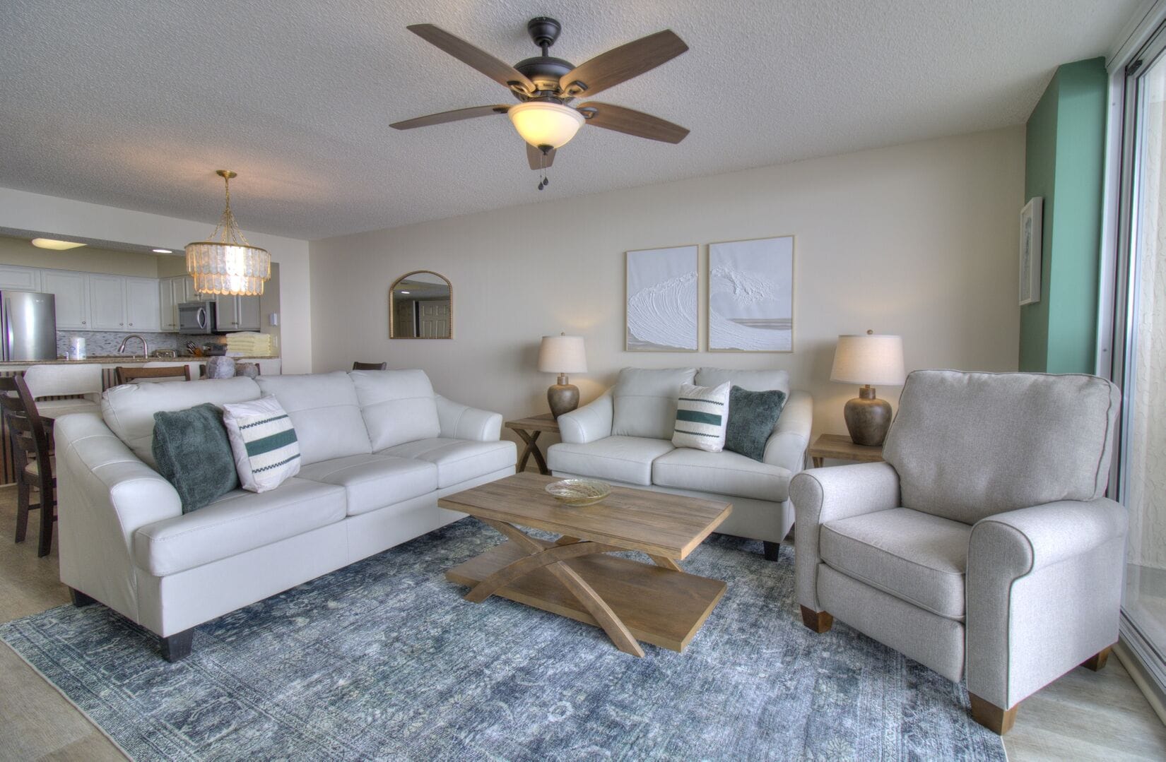 Modern living room with white furniture.