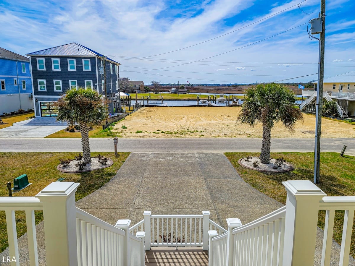 Beachfront view with palm trees.