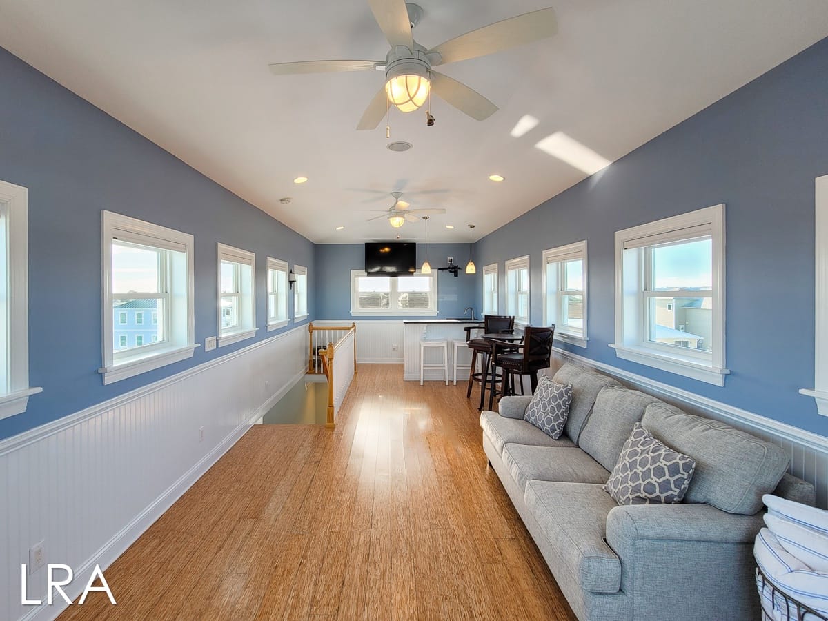 Bright living room with blue walls.