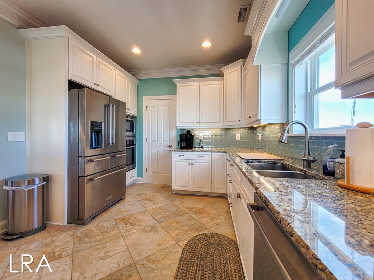 Modern kitchen with stainless steel appliances.