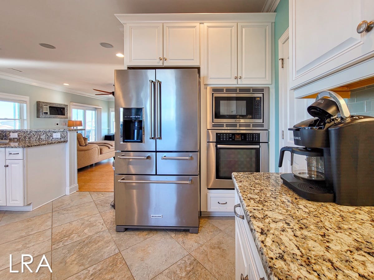 Modern kitchen with stainless appliances.