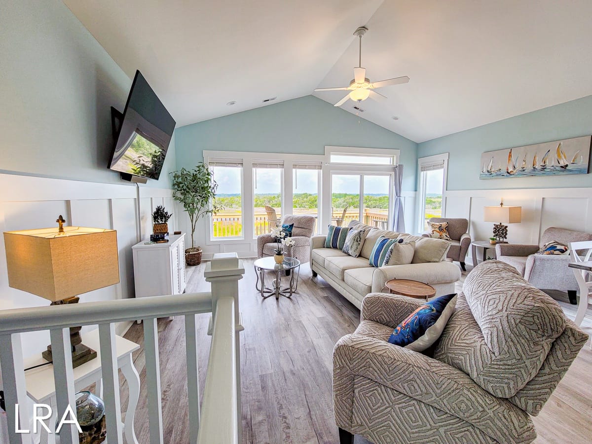 Cozy living room, large windows.