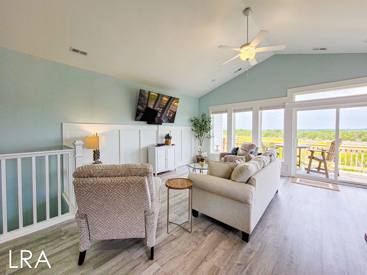 Bright living room with balcony view.