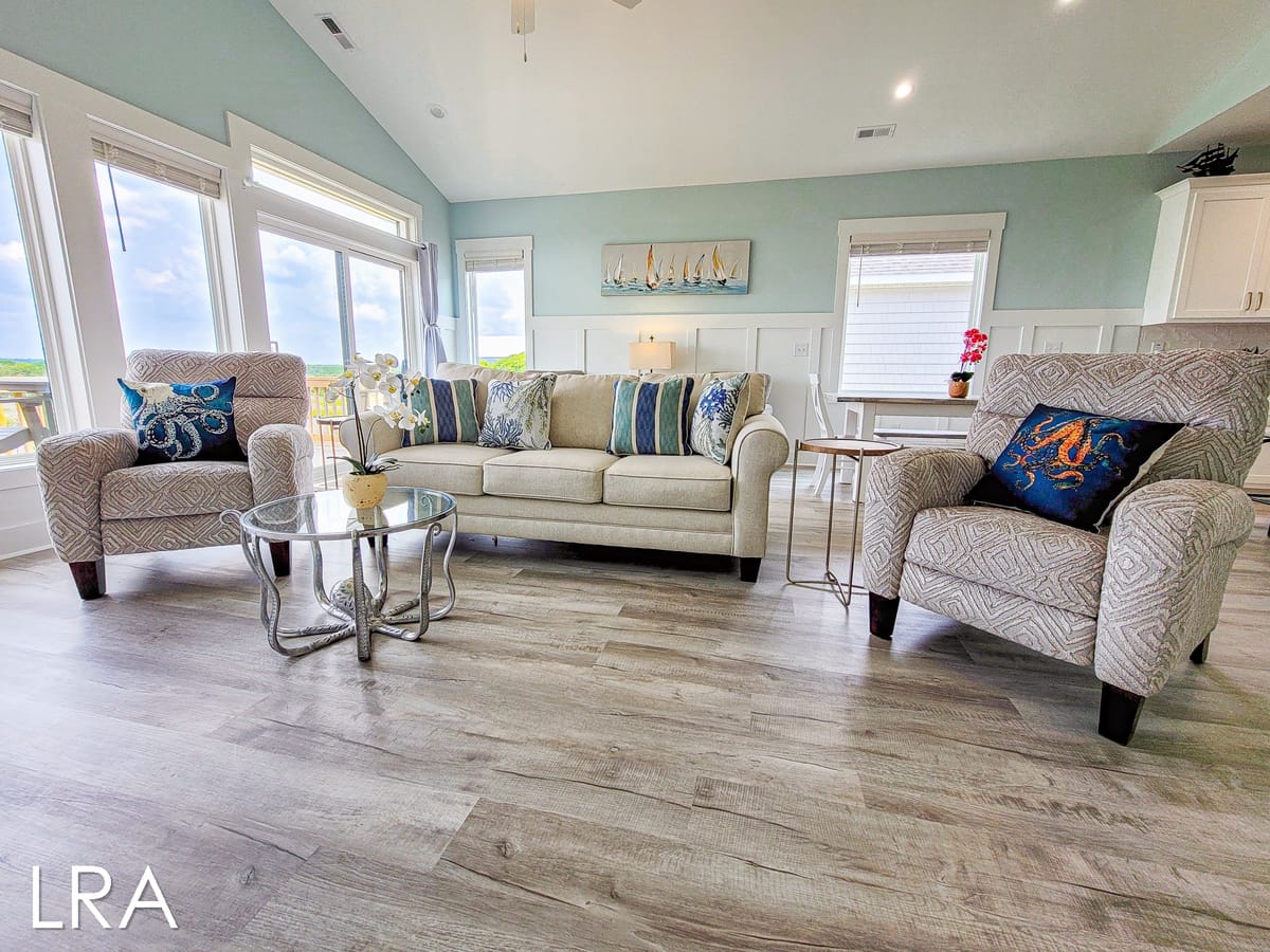 Coastal-themed living room with furniture.