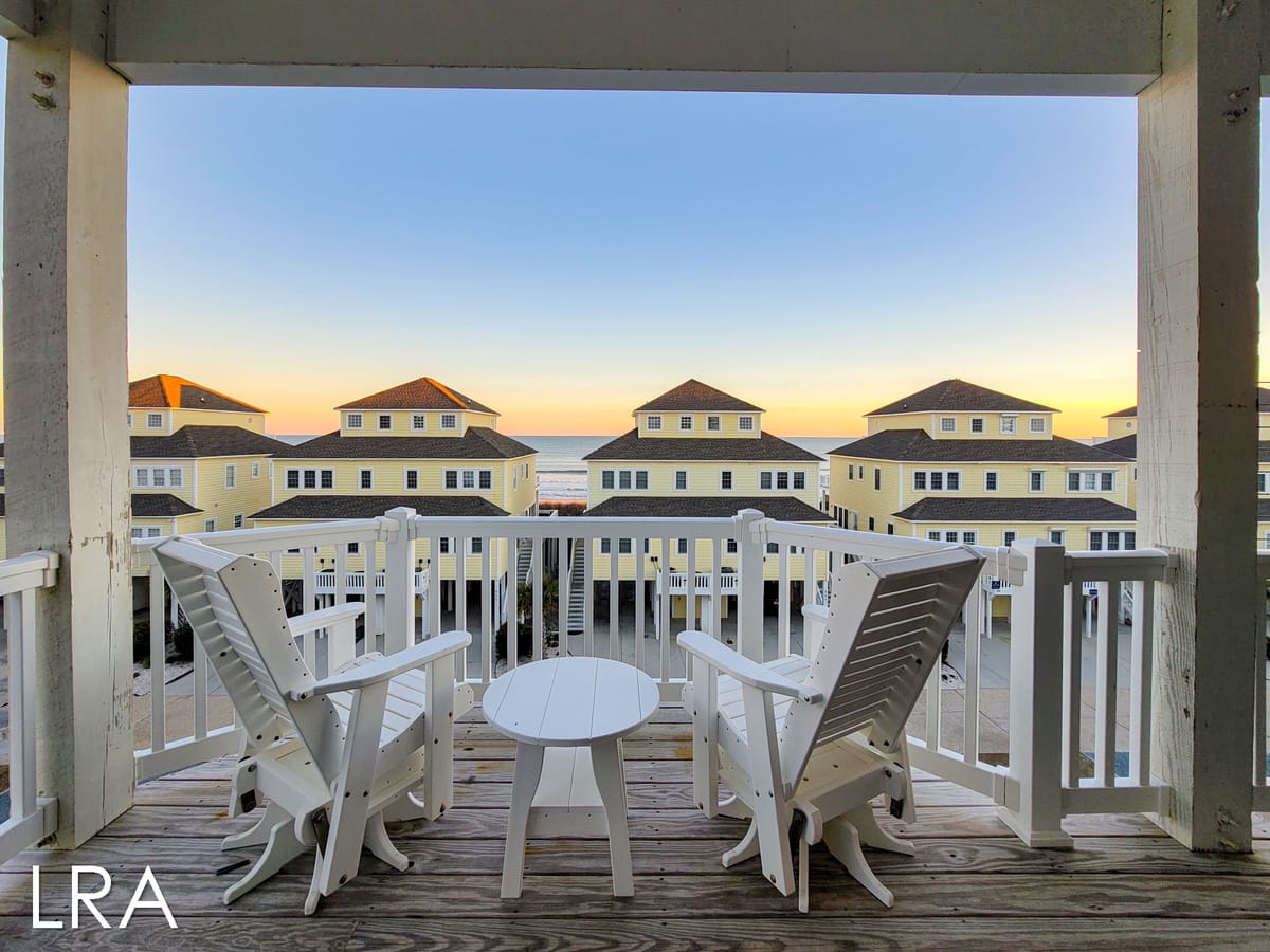 Deck with chairs, ocean view.