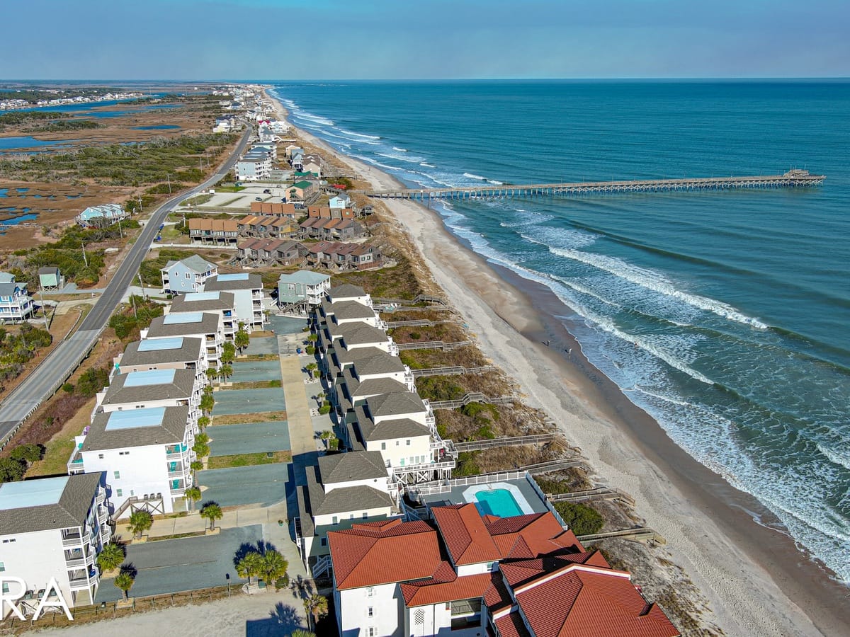 Coastal town with beachfront houses.