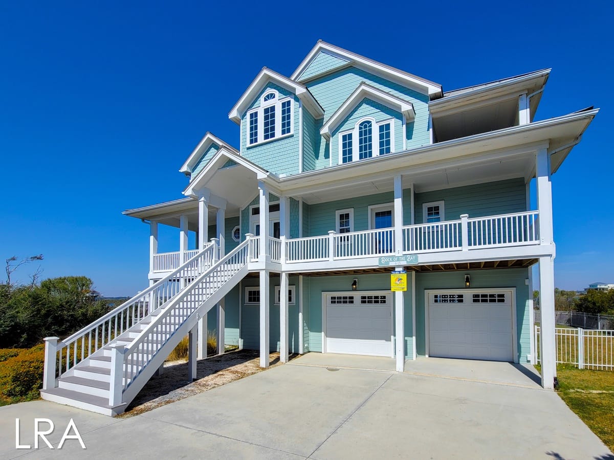 Light blue house with balconies.