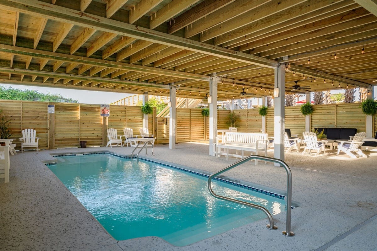 Covered pool area with seating.