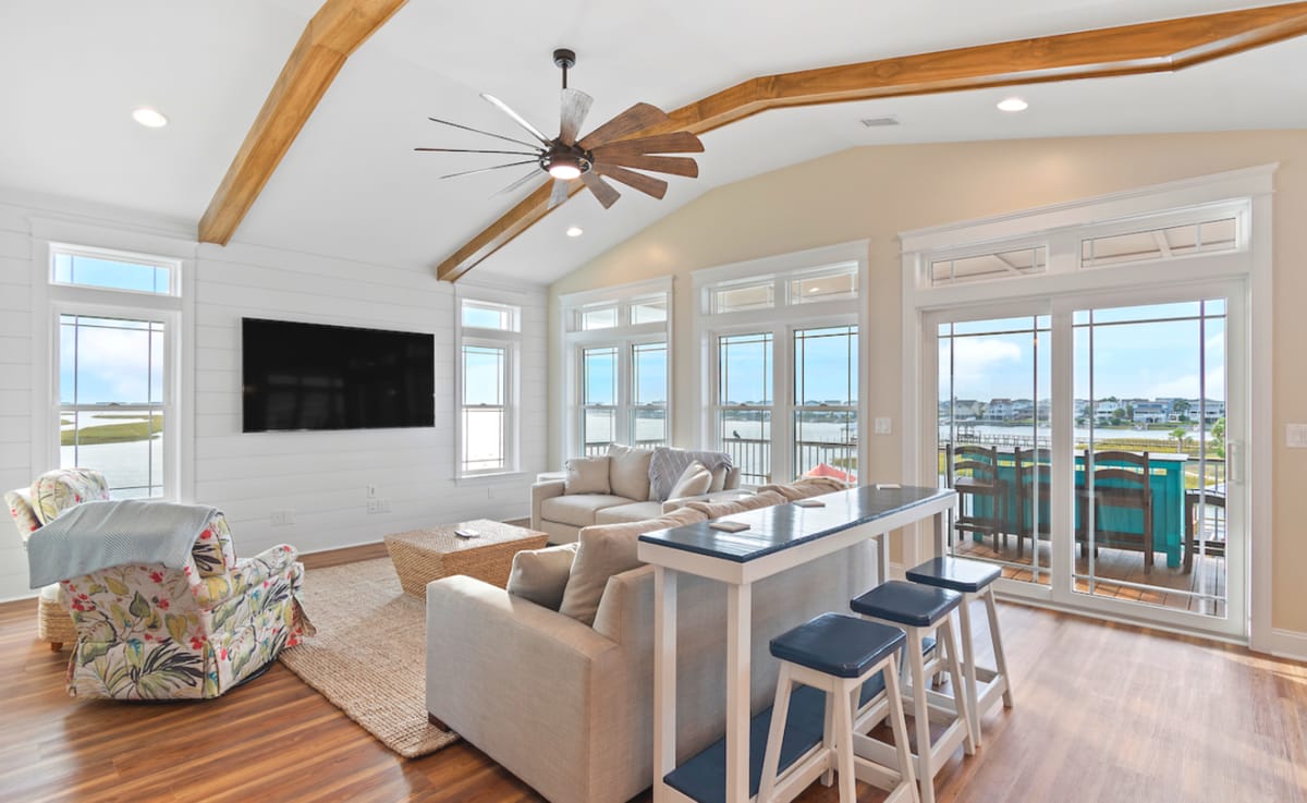 Spacious living room with large windows.