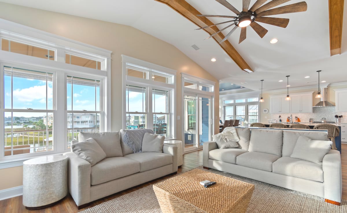 Bright living room with beige sofas.