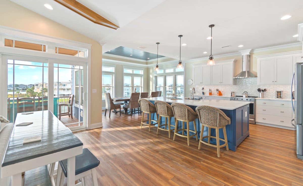 Open, modern kitchen and dining area.