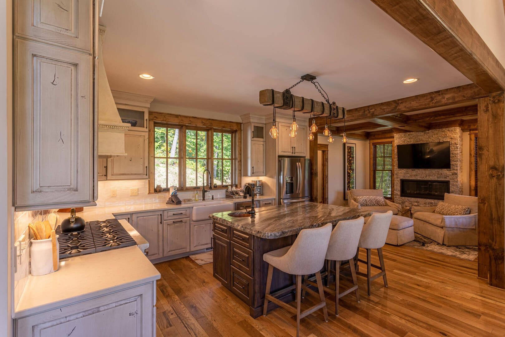 Rustic kitchen with island and seating.