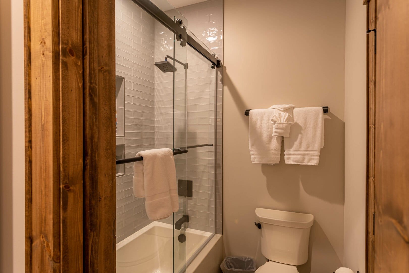 Bathroom with shower and towels.