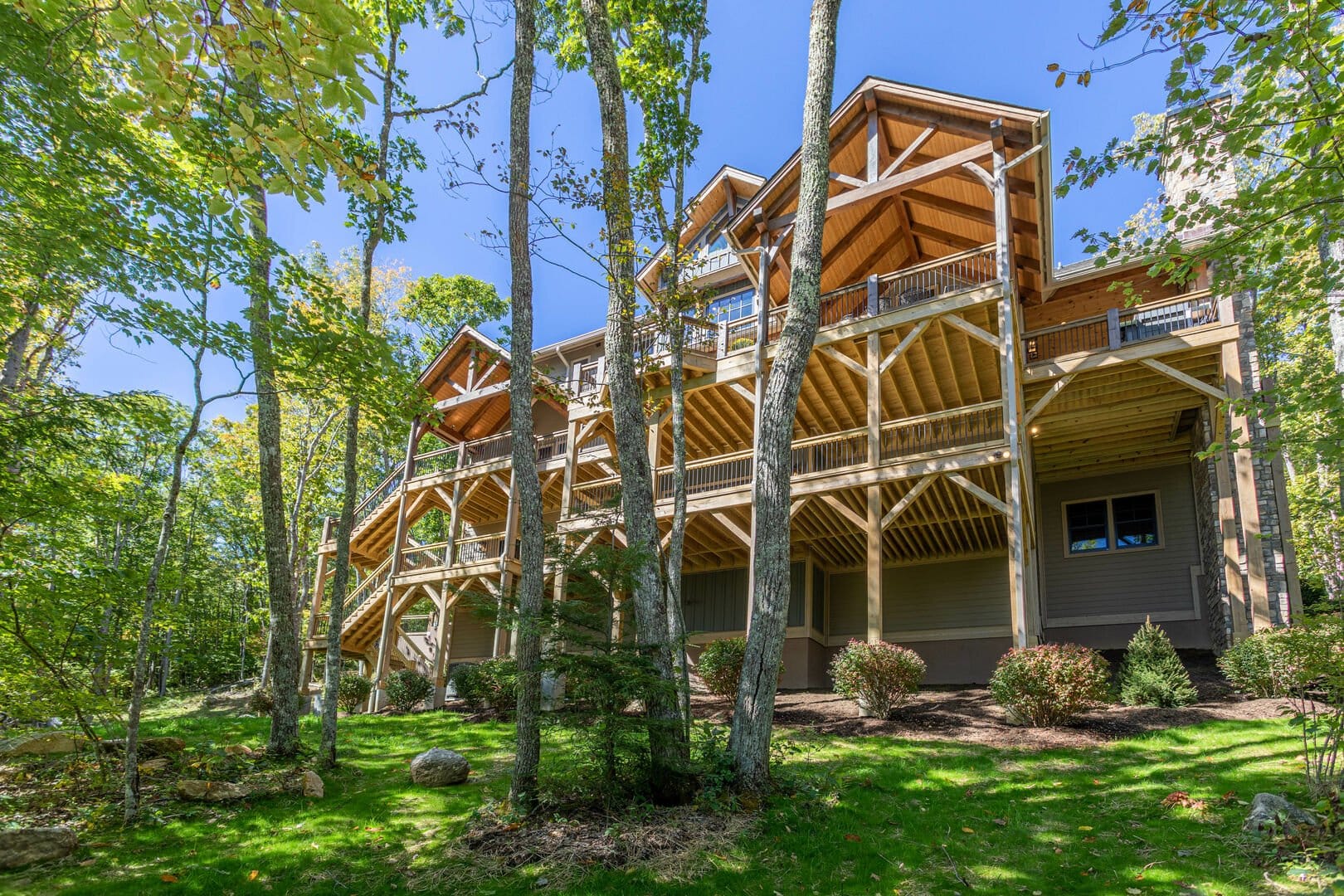 Wooden house in forest setting.