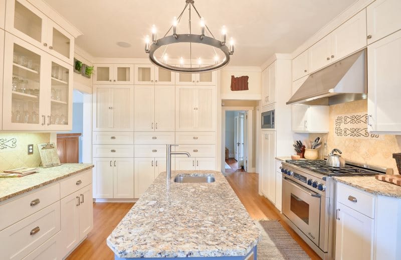 Bright kitchen with granite island.