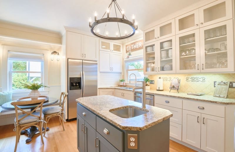 Bright kitchen with island and table.