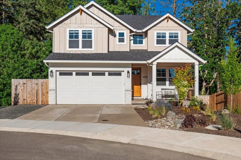 Two-story house with driveway.