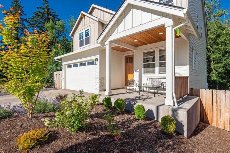 Modern house with garden and porch.