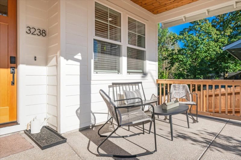 Outdoor patio with chairs and table.