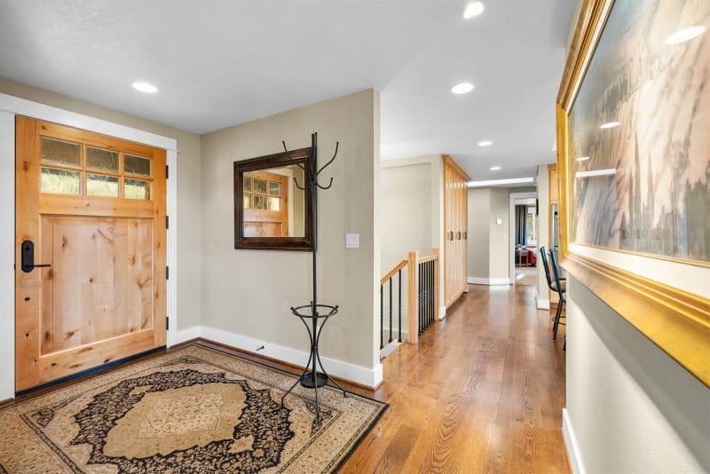 Wooden door entrance with hallway.