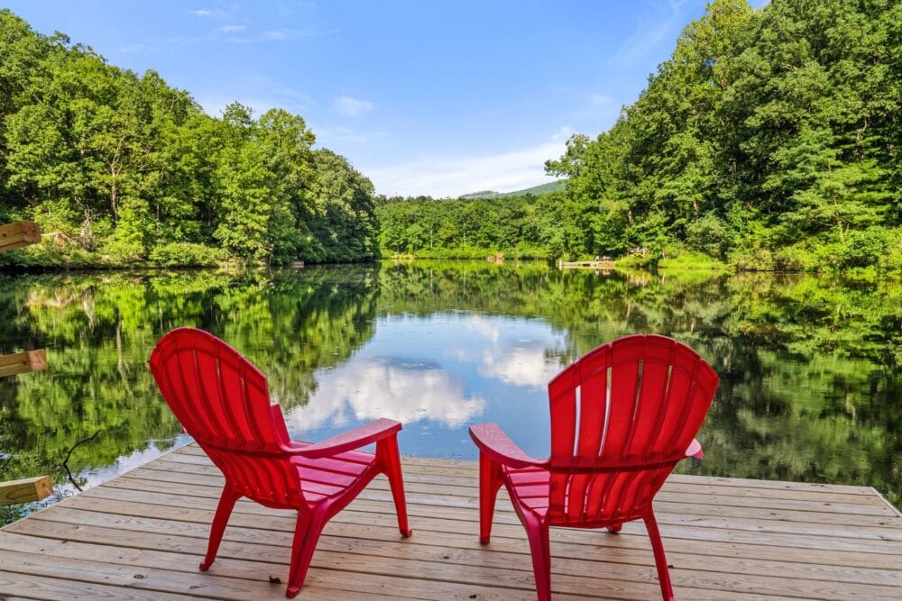 Two red chairs on dock.